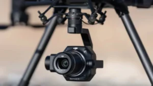 UAV Surveys 2 The underside of a black drone with a mounted camera.